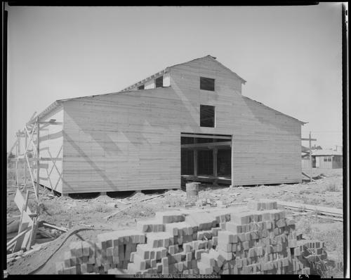 J. Fred Beggs & Sons, contractors (construction); Narcotic Farm; exterior, supply shed & shop building under construction
