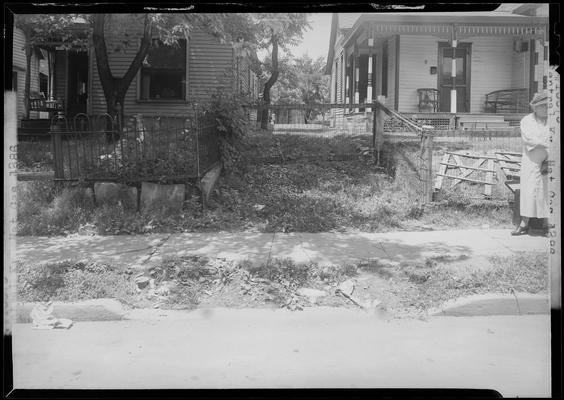 Central Kentucky Natural Gas Company (336 West Main); view of the sidewalk and fence bordering two adjacent houses