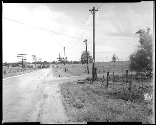 Winganeek Farm & wrecked truck; post accident scene photographs, view looking down the road (U.S. route 25), road intersection at mailbox