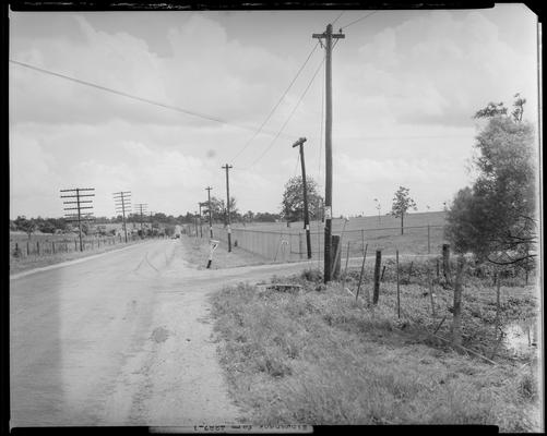 Winganeek Farm & wrecked truck; post accident scene photographs, view looking down the road (U.S. route 25), road intersection at mailbox