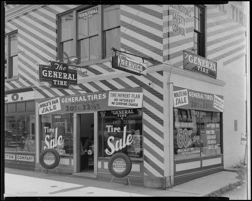 Lexington General Tire Company (254 East Main); exterior view of corner store front, tire sale signs posted on both sides of building