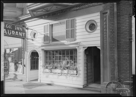 College Inn Restaurant, 207 East Main; exterior view of window display, entrance, and sign