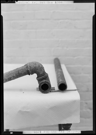 Central Kentucky Natural Gas Company (336 West Main); close-up view of pipes on a table