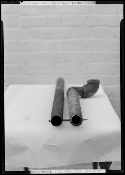 Central Kentucky Natural Gas Company (336 West Main); close-up view of pipes on a table