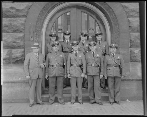 Fayette County Patrol; group portrait, uniformed officers standing in front of building entrance