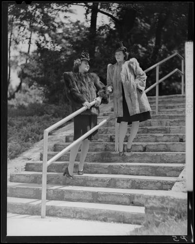 B.B. Smith & Company, 264 West Main; two women in fur coats standing on steps (modeling)