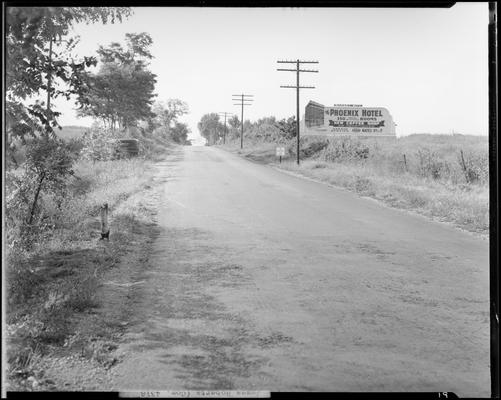 James Roberts; wrecked car; post accident scene photographs, view of roadway, billboard sign for the Phoenix Hotel