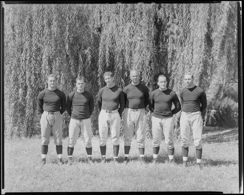 University of Kentucky; football coaches, group portrait, coaches standing on the playing field