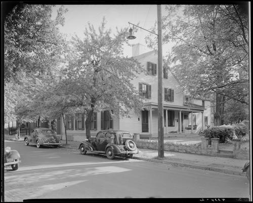 Kennedy House or Sloan & Baxter House; (Second Street?); exterior view from the street of a large three story house; cars parked along the curb