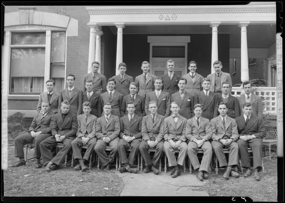 Phi Delta Theta; member group portrait on the porch of the fraternity house