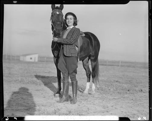 Annette Klingholz (1940 Kentuckian) (University of Kentucky); Annette Klingholz standing besides a horse