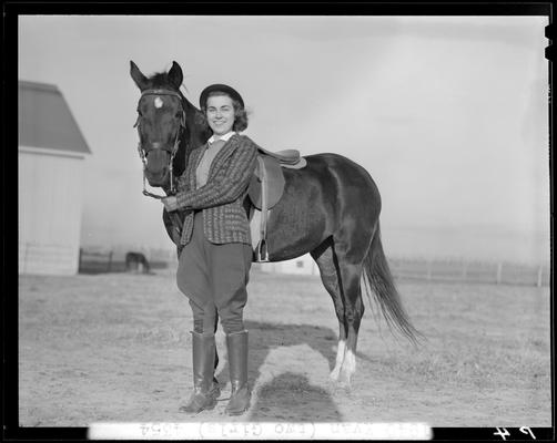 Annette Klingholz (1940 Kentuckian) (University of Kentucky); Annette Klingholz standing besides a horse