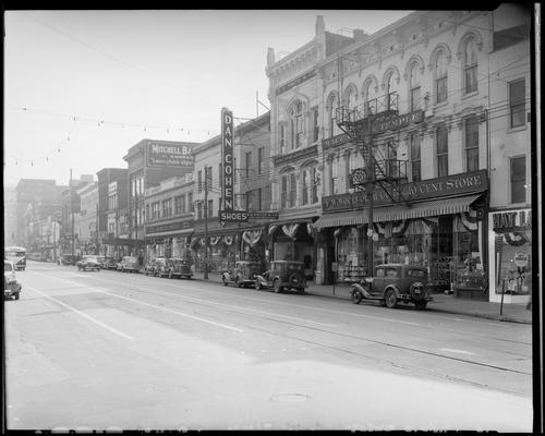 Main Street, looking east from Mill Street; Schulte-United, 236-246 West Main (department store); S.S. Kresge Co., 250-254 West Main; Dan Cohen Shoes, 258 West Main; B B Smith and Co., 264 West Main; F.W. Woolworth, 268-274 West Main