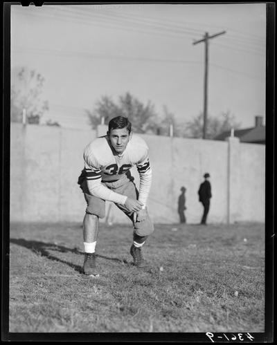 University of Kentucky Football; individual team member standing in a tackle stance, jersey number 36 (#36, thirty-six)