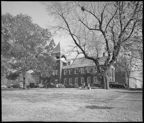 Campus scenes; Engineering Building (1940 Kentuckian) (University of Kentucky); exterior view of building, landscape, and cars parked in front of building