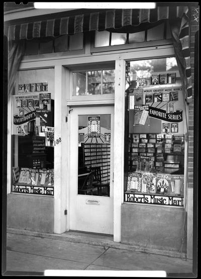 Roberts Music Mart (sheet music), 153 East High; exterior view of store front, window displays
