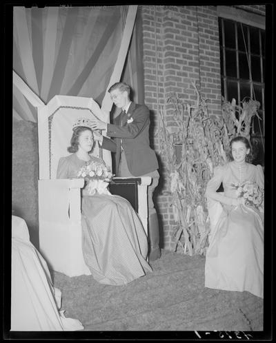 Queen of Stock Festival, (1940 Kentuckian) (University of Kentucky); man placing crown on queens head