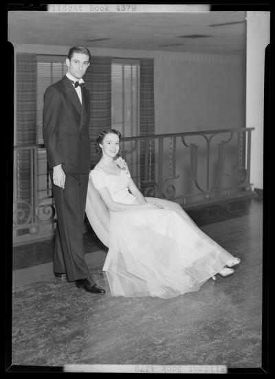 Wildcat Book; man and a woman in formal dress (attire) (couple), man is standing next to seated woman