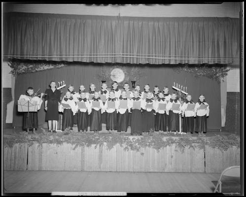 Ashland School (195 North Ashland Avenue); fourth & sixth grade, students on stage singing Christmas carols