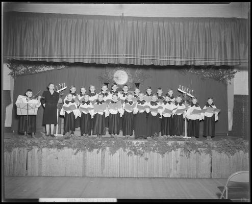 Ashland School (195 North Ashland Avenue); fourth & sixth grade, students on stage singing Christmas carols