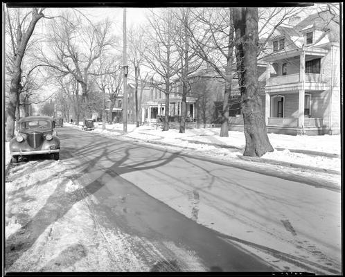 John S. Yellman; post accident scene photograph, view of tree-lined street and houses