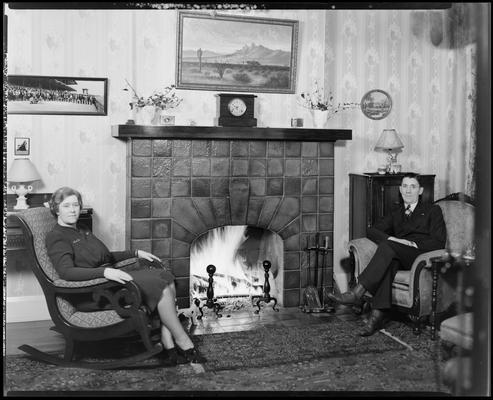 W.B. Griggs; interior of home; man and woman sitting next to a fireplace