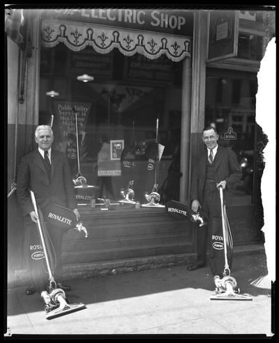 Electric Shop; exterior, 103 North Broadway, (men with Royal and Royalette vacuum cleaners)