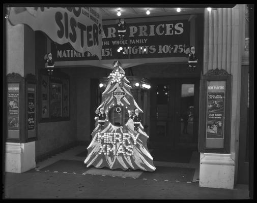 State Theatre (movie theater), 220 East Main, exterior; ticket booth decorated as a Christmas tree; lobby cards and partially visible marquee advertise 