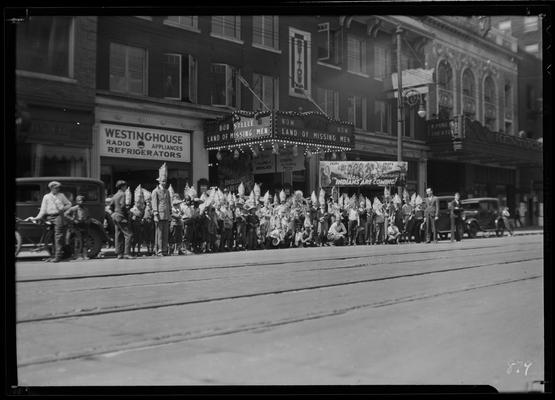 State Theatre (movie theater), 220 East Main, exterior, street scene; dozens of children dressed as Native-Americans to promote 