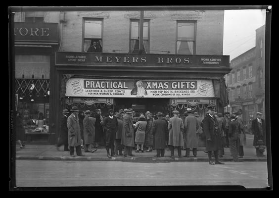 Meyers Brothers (278 West Main and Mill Streets), exterior (Christmas sale); large group gathered in front of store
