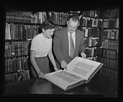 Dr. Thompson Mrs. Lacker with Rare book Gutenberg Bible reprint