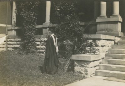 a woman in graduation cap and gown