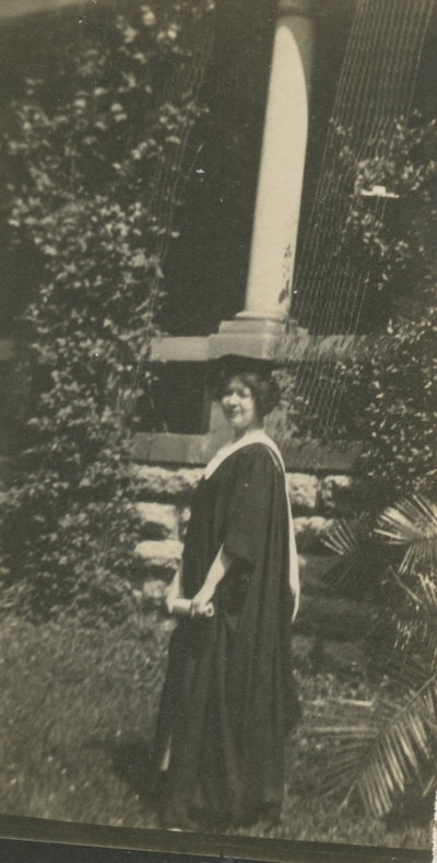 a woman in graduation cap and gown (appears to be the same woman as in item #25)
