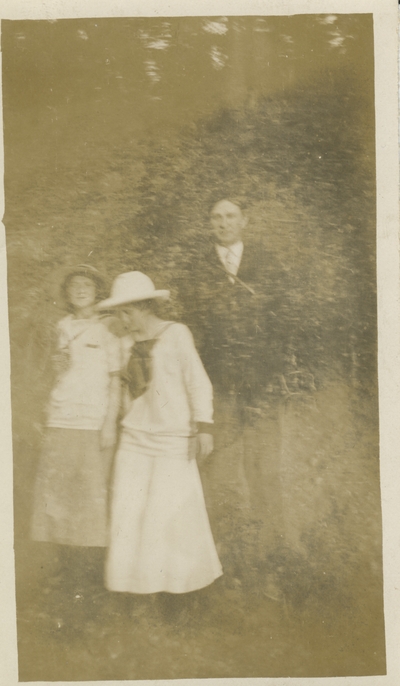 2 women and a man, photograph is a little blurry