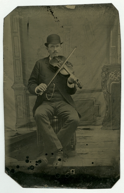Portrait of an unidentified man holding a violin
