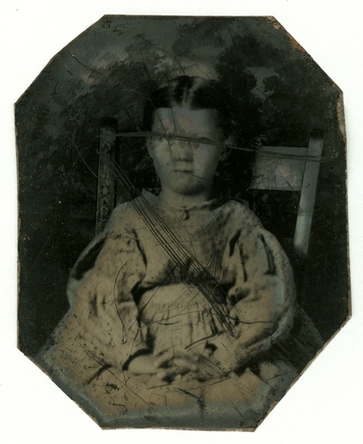 Portrait of an unidentified girl, on left, in an eight-sided case. Image no. 87 and 88 form a hinged case set