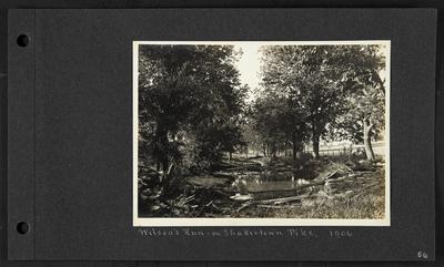 Creek with roughly constructed barbed wire fence strung across it, notation                          Wilson's Run on Shakertown Pike, 1906