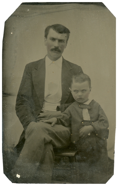 Unidentified man with small boy