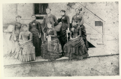 Group portrait of seven African American women and one Caucasian man, unidentified. Reproduction