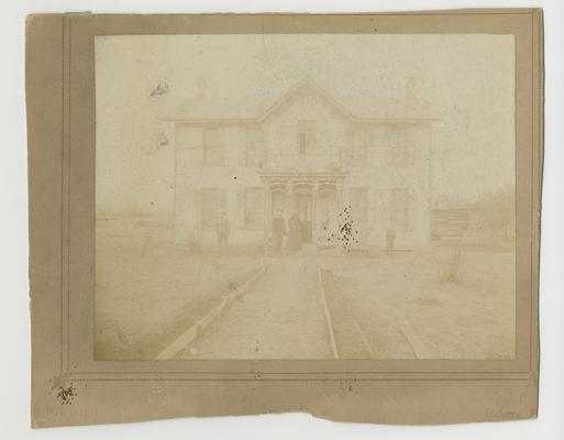Unidentified family and house photograph