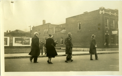 Three men and two women walking down street in Pineville, Ky