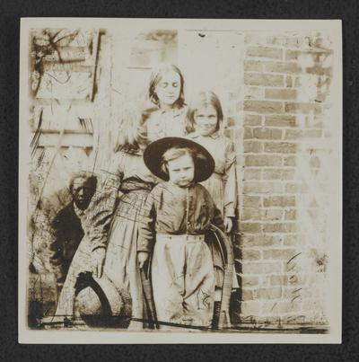 Four young girls and one boy standing