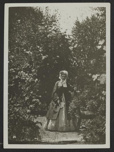 Well dressed woman in garden