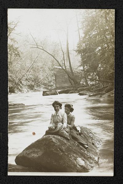 Females, unidentified, floating down Big Sandy