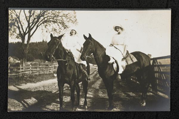 Females, unidentified, riding horses