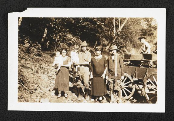 Cora Wilson Stewart posing with unidentified men, women, and children in front of a horse drawn carriage, similar photograph to item #60, taken the same day as item #217