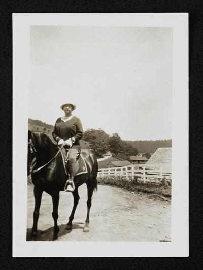 Cora Wilson Stewart riding a horse
