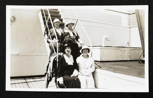 Cora Wilson Stewart and four unidentified women posing on the steps of a large passenger ship