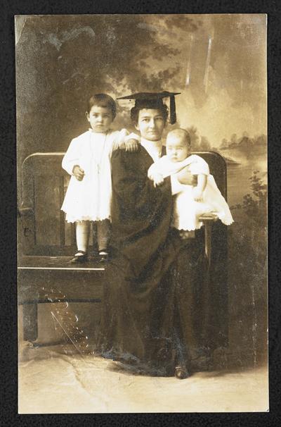 Nebraska State Normal, Kearney, now a normal college. Mrs. Axmaker, graduate in class of 1911. Taken with her two grandchildren