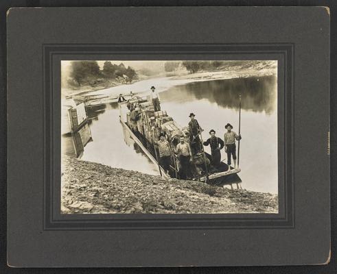 Seven unidentified males on a barge with supplies. Bottom of the photograph reads: Big Sandy Transportation before Railroads